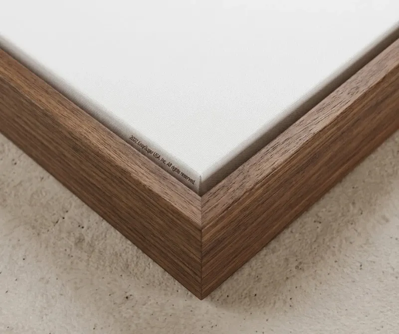 Close-up of wooden frame around a stretched canvas print