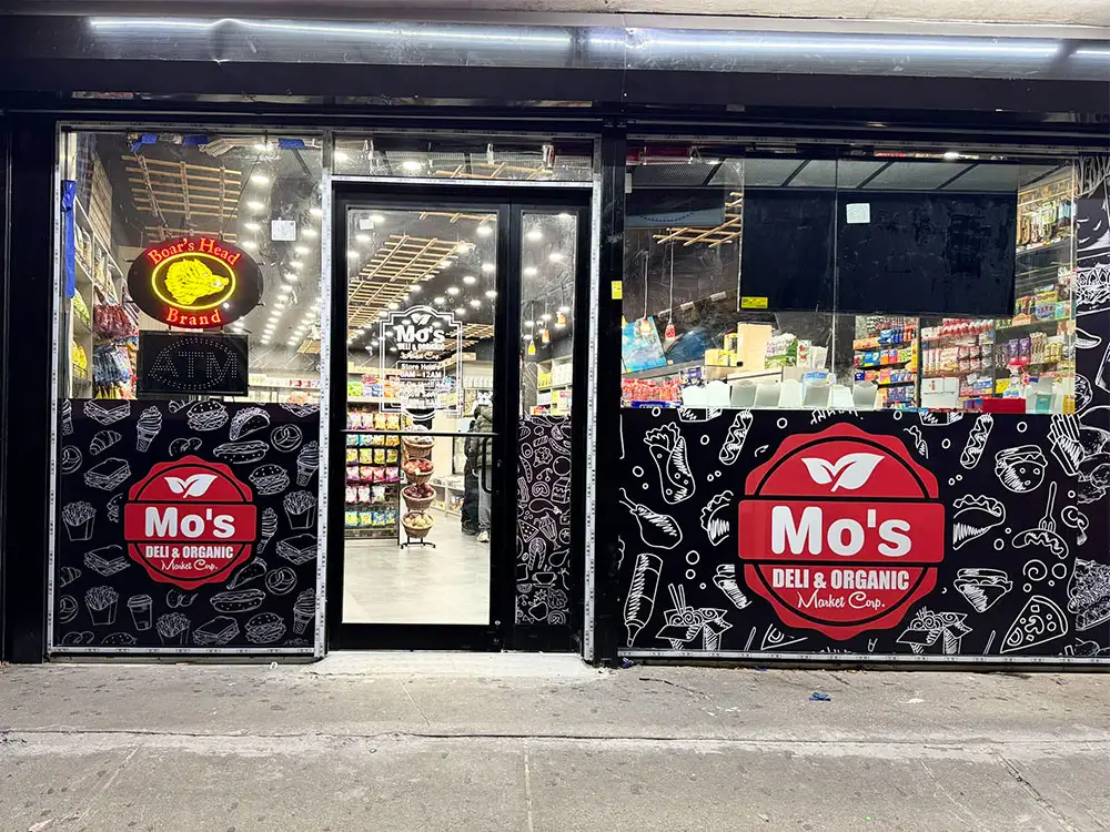 Food store window vinyl graphics installation