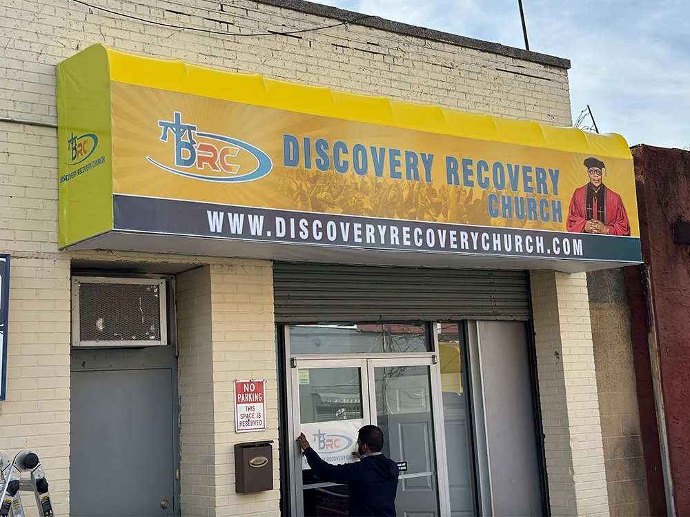 Recovery center awning with business graphics