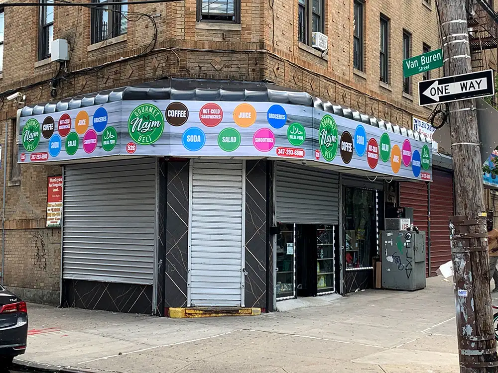 Retail storefront signage with commercial graphics