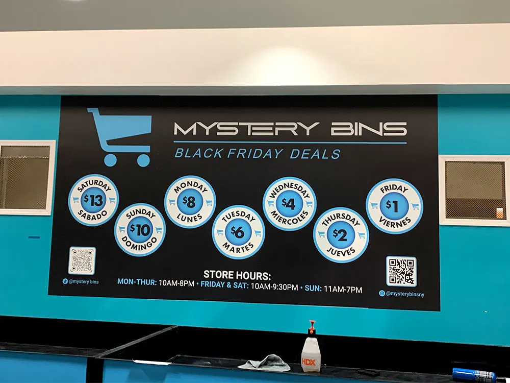 Retail wall branding display with pricing graphics