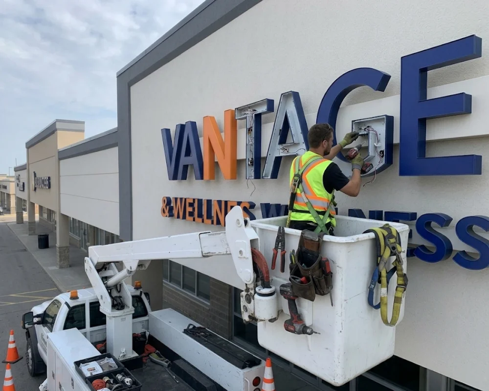 Illuminated sign repair service for damaged exterior business signs